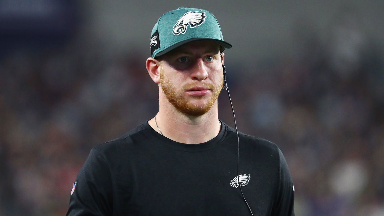 FOXBOROUGH, MA - AUGUST 16: Carson Wentz #11 of the Philadelphia Eagles looks on from the sidelines in the first half against the New England Patriots during the preseason game at Gillette Stadium on August 16, 2018 in Foxborough, Massachusetts.