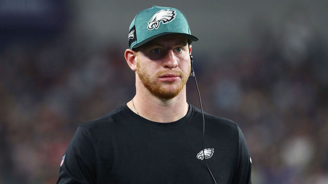 FOXBOROUGH, MA - AUGUST 16: Carson Wentz #11 of the Philadelphia Eagles looks on from the sidelines in the first half against the New England Patriots during the preseason game at Gillette Stadium on August 16, 2018 in Foxborough, Massachusetts.