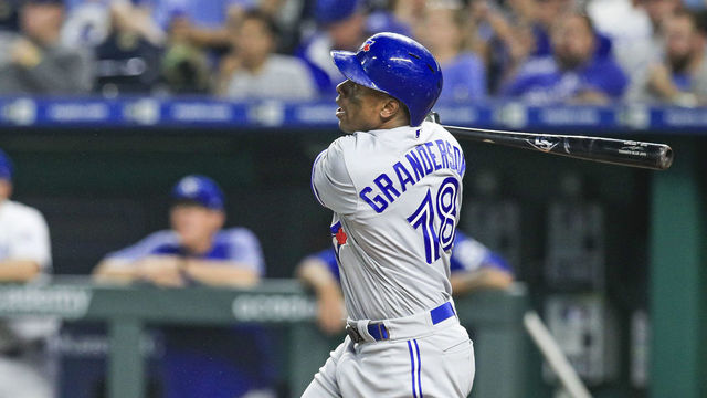 KANSAS CITY, MO - AUGUST 15: Curtis Granderson #18 of the Toronto Blue Jays hits a grand slam home run against the Kansas City Royals during the fourth inning at Kauffman Stadium on August 15, 2018 in Kansas City, Missouri.