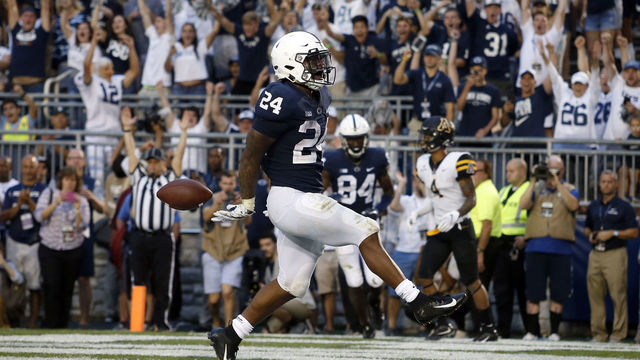 STATE COLLEGE, PA - SEPTEMBER 01: Miles Sanders #24 of the Penn State Nittany Lions rushes for a 4 yard touchdown in overtime against the Appalachian State Mountaineers on September 1, 2018 at Beaver Stadium in State College, Pennsylvania.