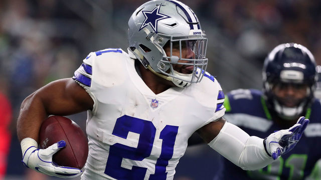 ARLINGTON, TX - DECEMBER 24: Ezekiel Elliott #21 of the Dallas Cowboys carries the ball against the Seattle Seahawks in the first quarter of a football game at AT&T Stadium on December 24, 2017 in Arlington, Texas.