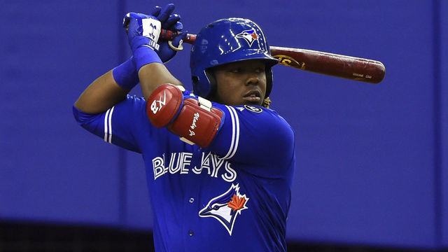 MONTREAL, QC - MARCH 27: Vladimir Guerrero Jr. #27 of the Toronto Blue Jays prepares to bat against the St. Louis Cardinals during the MLB preseason game at Olympic Stadium on March 27, 2018 in Montreal, Quebec, Canada. The Toronto Blue Jays defeated St. Louis Cardinals 1-0.