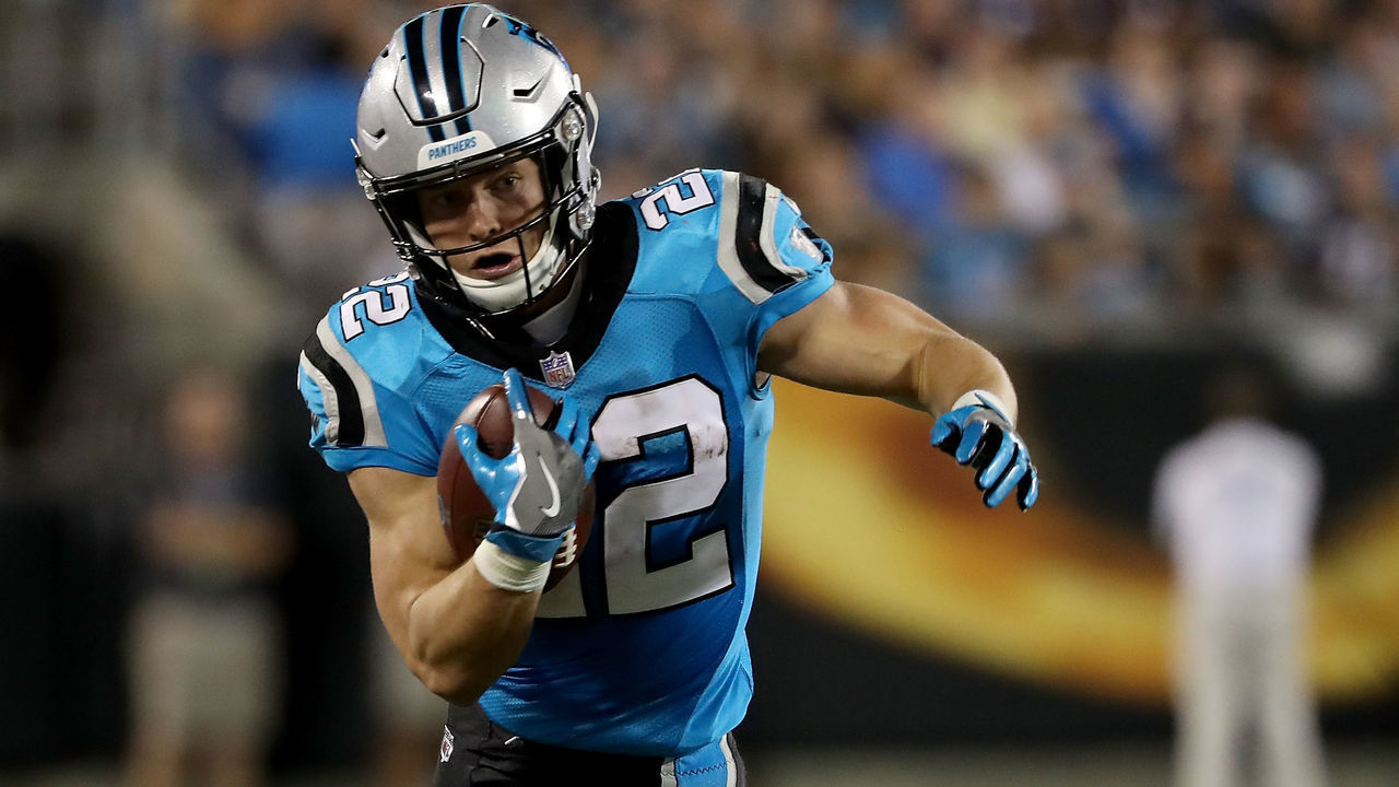 CHARLOTTE, NC - AUGUST 24: Christian McCaffrey #22 of the Carolina Panthers runs the ball against the New England Patriots in the second quarter during their game at Bank of America Stadium on August 24, 2018 in Charlotte, North Carolina.
