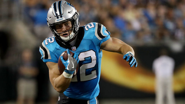 CHARLOTTE, NC - AUGUST 24: Christian McCaffrey #22 of the Carolina Panthers runs the ball against the New England Patriots in the second quarter during their game at Bank of America Stadium on August 24, 2018 in Charlotte, North Carolina.