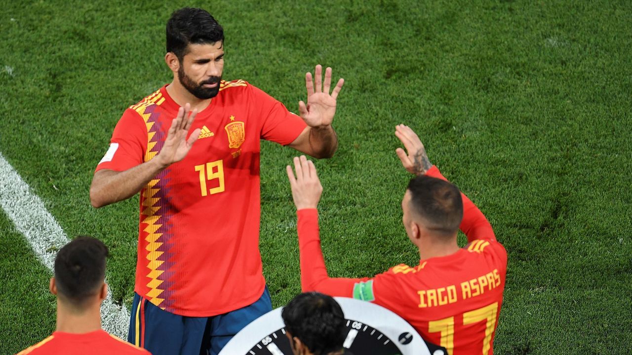 Spain's forward Diego Costa (L) leavs the pitch substituted by Spain's forward Iago Aspas during the Russia 2018 World Cup Group B football match between Spain and Morocco at the Kaliningrad Stadium in Kaliningrad on June 25, 2018.