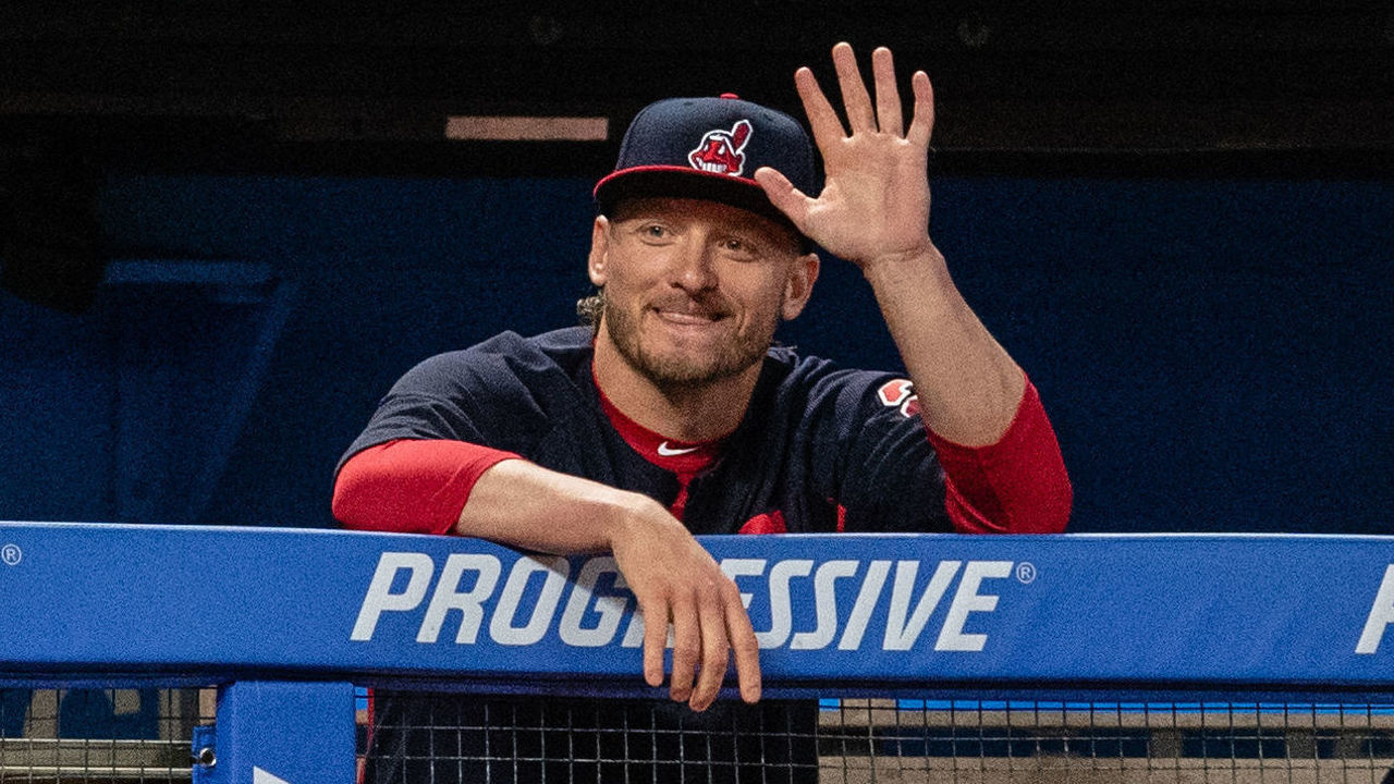 CLEVELAND, OH - SEPTEMBER 1: Josh Donaldson #27 of the Cleveland Indians joins Carlos Carrasco #59 on the bench and waves to the Tampa Bay Rays bench during the fifth inning at Progressive Field on September 1, 2018 in Cleveland, Ohio. Donaldson is the Indians latest trade coming from the Toronto Blue Jays.