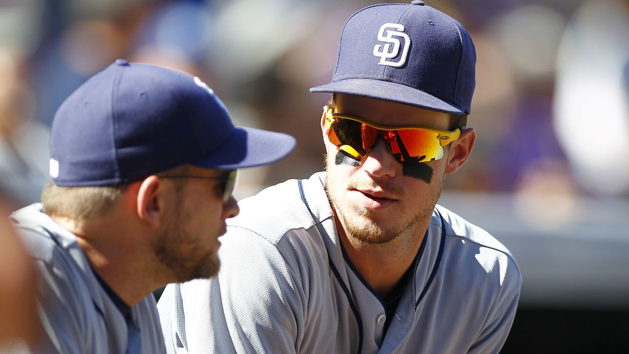 DENVER, CO - SEPTEMBER 18: Wil Myers #4 chats with Andy Green #14 of the San Diego Padres prior to a regular season MLB game between the Colorado Rockies and the visiting San Diego Padres at Coors Field on September 18, 2016 in Denver, Colorado.