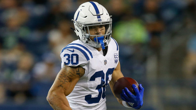 SEATTLE, WA - AUGUST 09: Running back Jordan Wilkins #30 of the Indianapolis Colts rushes against the Seattle Seahawks at CenturyLink Field on August 9, 2018 in Seattle, Washington.