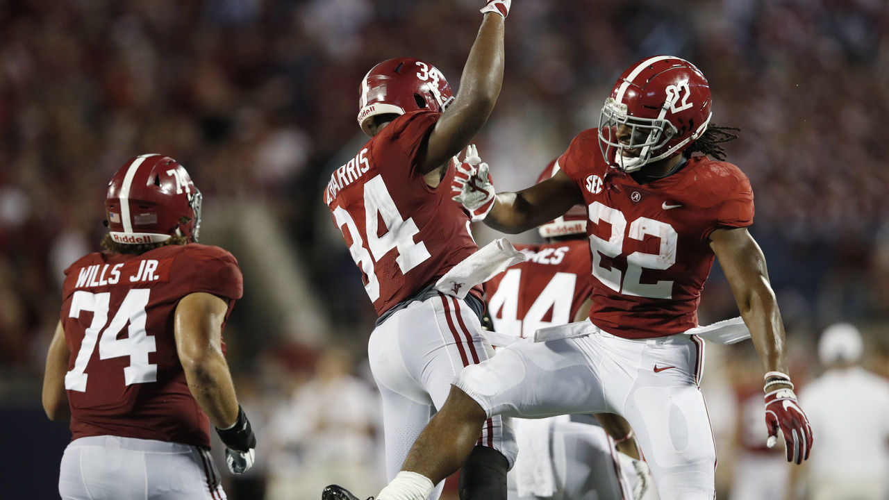 ORLANDO, FL - SEPTEMBER 01: Najee Harris #22 of the Alabama Crimson Tide celebrates with Damien Harris #34 after a one-yard touchdown run in the second quarter of the game against the Louisville Cardinals at Camping World Stadium on September 1, 2018 in Orlando, Florida.