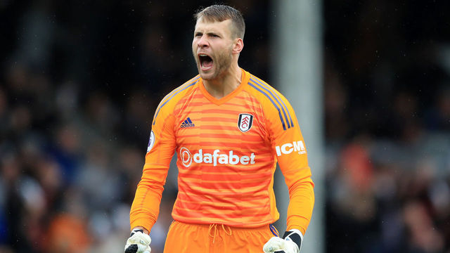 LONDON, ENGLAND - AUGUST 26: Marcus Bettinelli of Fulham celebrates after teammate Jean Michael Seri scores their team's first goal during the Premier League match between Fulham FC and Burnley FC at Craven Cottage on August 26, 2018 in London, United Kingdom.