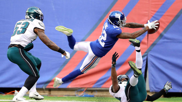 EAST RUTHERFORD, NJ - DECEMBER 17: Tavarres King #12 of the New York Giants dives for the endzone in the third quarter against the Philadelphia Eagles during their game at MetLife Stadium on December 17, 2017 in East Rutherford, New Jersey.
