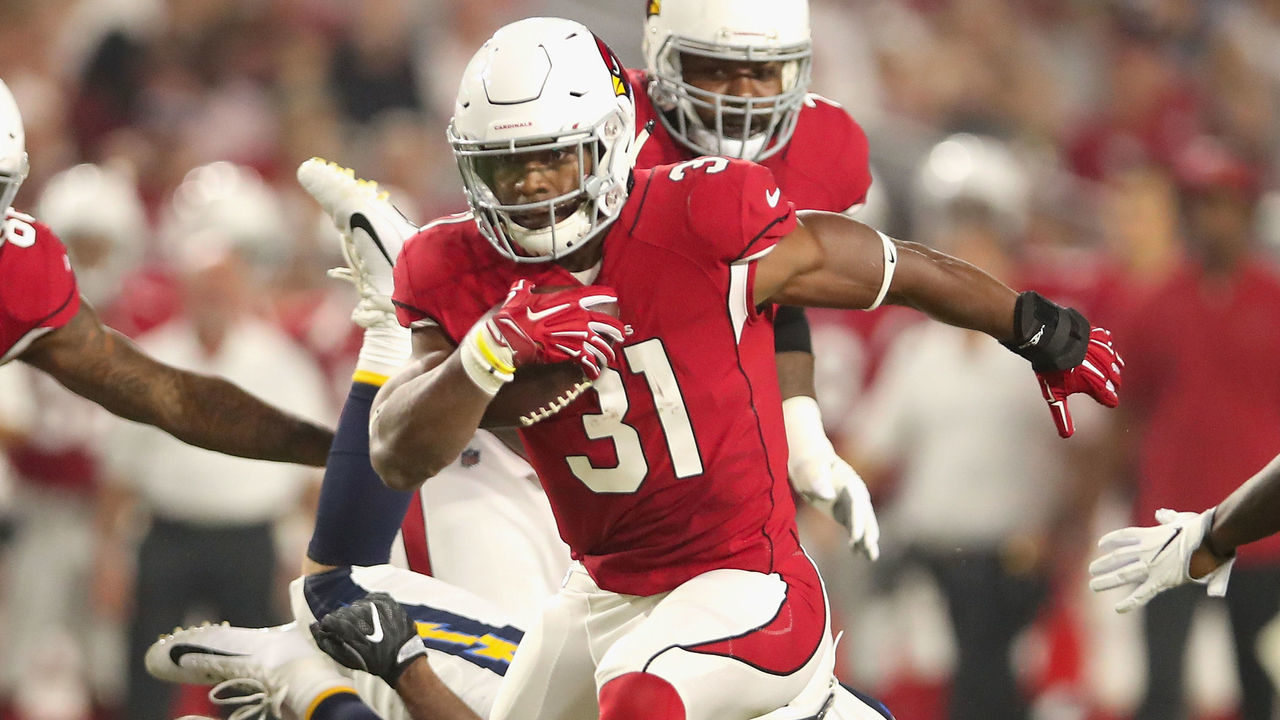 GLENDALE, AZ - AUGUST 11: Running back David Johnson #31 of the Arizona Cardinals rushes the football against the Los Angeles Chargers during the first half of the preseason NFL game at University of Phoenix Stadium on August 11, 2018 in Glendale, Arizona.