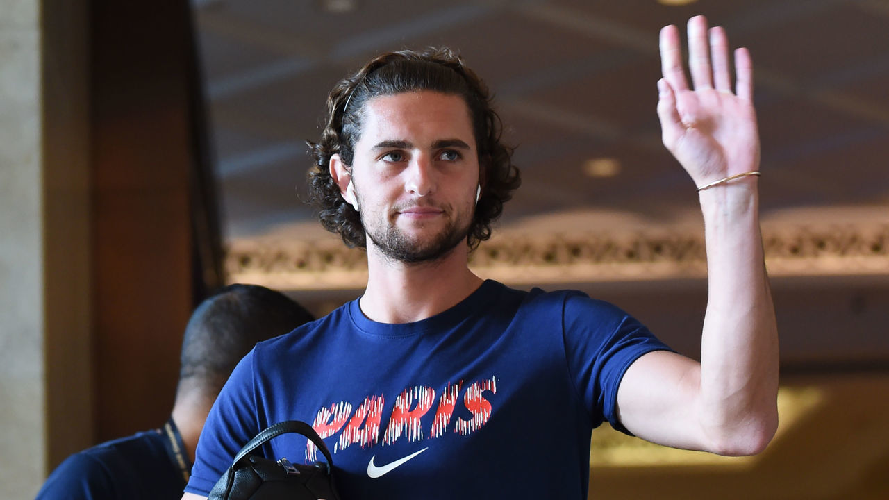 Paris Saint-Germain's French midfielder Adrien Rabiot gestures as he leaves the hotel to go to a training session in Shenzhen on August 2, 2018, two days before the French Trophy of Champions football match between Monaco and Paris Saint-Germain.
