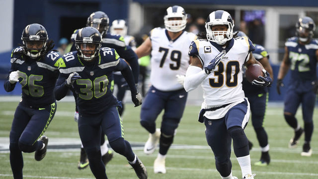 SEATTLE, WA - DECEMBER 17: Running back Todd Gurley #30 of the Los Angeles Rams rushes against the Seattle Seahawks during the game at CenturyLink Field on December 17, 2017 in Seattle, Washington.