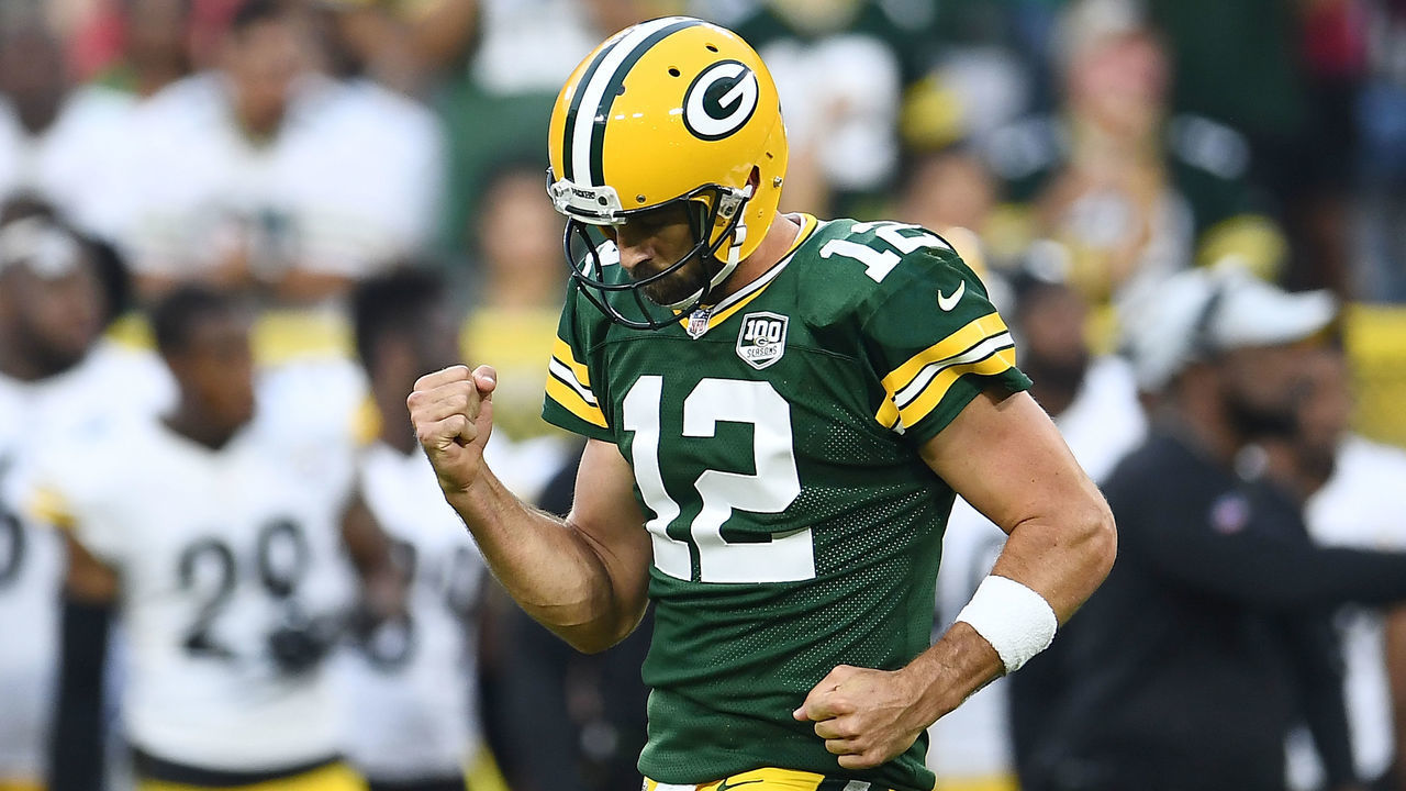 GREEN BAY, WI - AUGUST 16: Aaron Rodgers #12 of the Green Bay Packers celebrates a touchdown pass during the first quarter of a preseason game against the Pittsburgh Steelers at Lambeau Field on August 16, 2018 in Green Bay, Wisconsin.