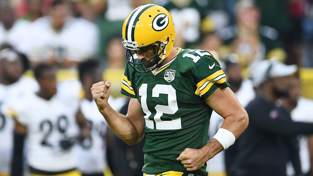 GREEN BAY, WI - AUGUST 16: Aaron Rodgers #12 of the Green Bay Packers celebrates a touchdown pass during the first quarter of a preseason game against the Pittsburgh Steelers at Lambeau Field on August 16, 2018 in Green Bay, Wisconsin.