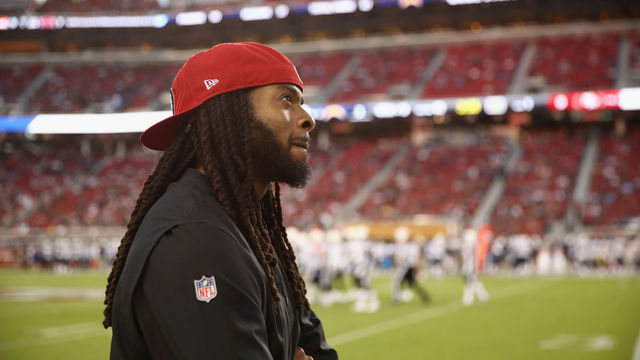 SANTA CLARA, CA - AUGUST 30: Richard Sherman #25 of the San Francisco 49ers watches a replay on the big screen during their preseason game against the Los Angeles Chargers at Levi's Stadium on August 30, 2018 in Santa Clara, California.
