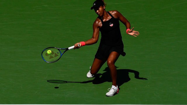 NEW YORK, NY - SEPTEMBER 05: Naomi Osaka of Japan returns the ball during her women's singles quarter-final match against Lesia Tsurenko of Ukraine on Day Ten of the 2018 US Open at the USTA Billie Jean King National Tennis Center on September 5, 2018 in the Flushing neighborhood of the Queens borough of New York City.