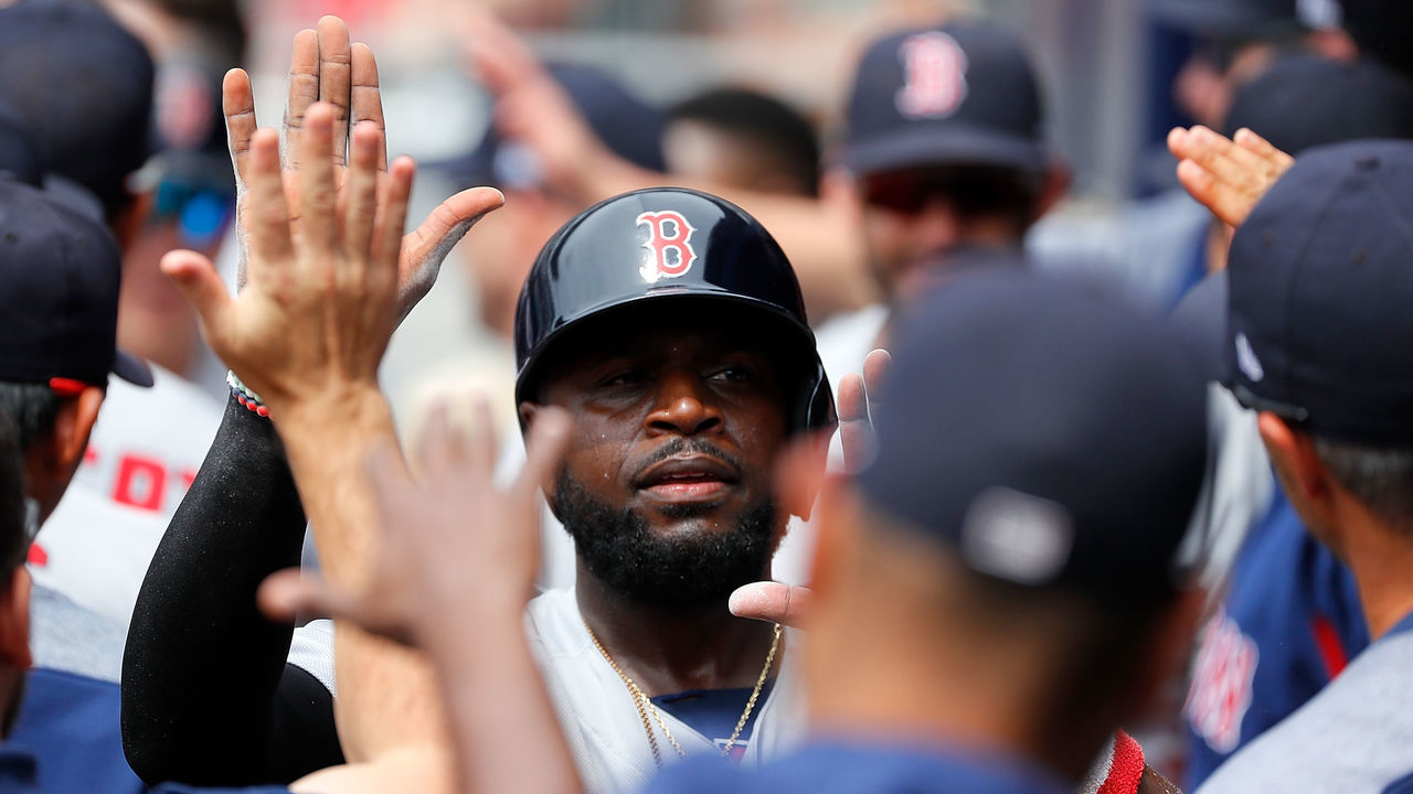 ATLANTA, GA - SEPTEMBER 05: Brandon Phillips #0 of the Boston Red Sox reacts after scoring against Tyler Flowers #25 of the Atlanta Braves after a ground out by Brock Holt #12 in the second inning at SunTrust Park on September 5, 2018 in Atlanta, Georgia.