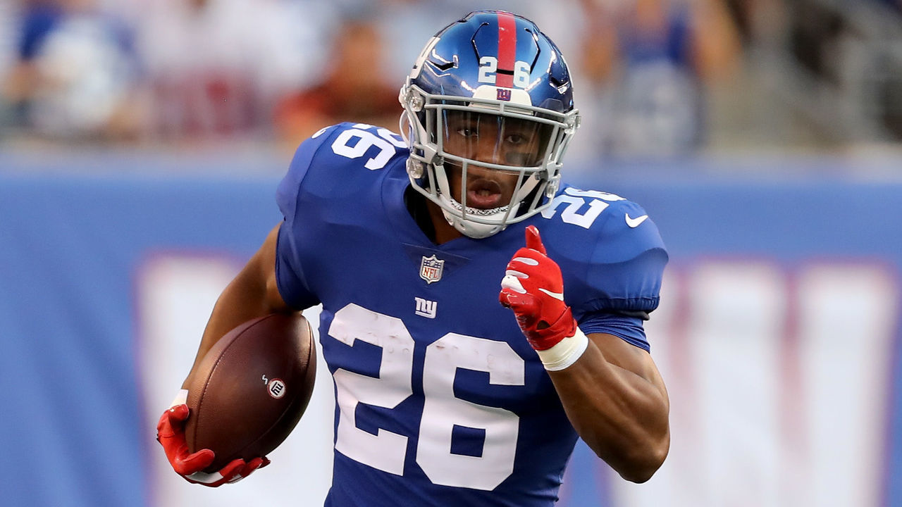 EAST RUTHERFORD, NJ - AUGUST 09: Saquon Barkley #26 of the New York Giants carries the bal in the first quarter against the Cleveland Browns during their preseason game on August 9,2018 at MetLife Stadium in East Rutherford, New Jersey.