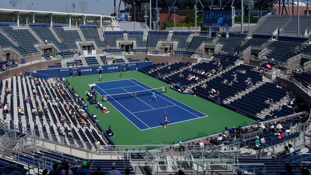 Juan Sebastian Cabal and Robert Farah, both of Colombia, compete against Ivan Dodig of Croatia and Marcel Granollers of Spain on the Grandstand Court during their 2018 US Open men's doubles round 3 match September 4, 2018 in New York.