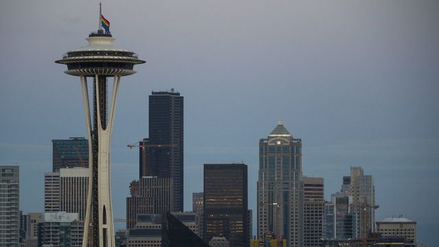 A rainbow flag flies at half mast on the Space Needle in Seattle, Washington on June 12, 2016, in honor of the victims of the nightclub shooting in Orlando. Fifty people died when a gunman allegedly inspired by the Islamic State group opened fire inside a gay nightclub in Florida, in the worst terror attack on US soil since September 11, 2001. / AFP / OMAR TORRES