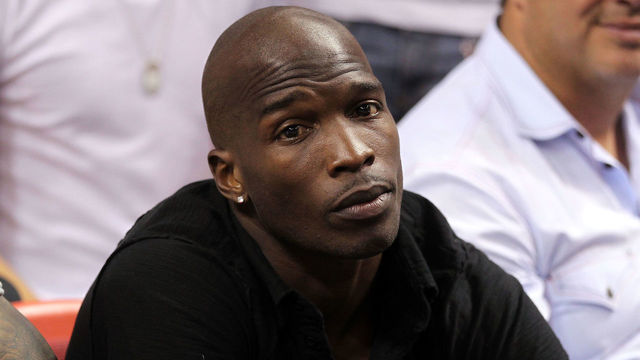 MIAMI, FL - MAY 24: Chad 'Ochocinco' Johnson watches the Miami Heat play against the Chicago Bulls in Game Four of the Eastern Conference Finals during the 2011 NBA Playoffs on May 24, 2011 at American Airlines Arena in Miami, Florida.