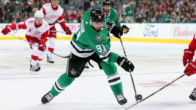 DALLAS, TX - OCTOBER 10: Tyler Seguin #91 of the Dallas Stars shoots the puck against Mike Green #25 of the Detroit Red Wings in the first period at American Airlines Center on October 10, 2017 in Dallas, Texas.
