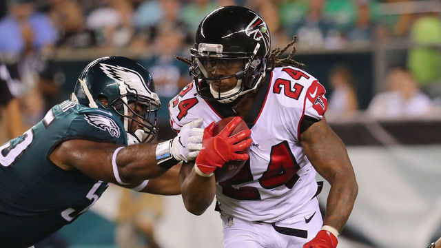 PHILADELPHIA, PA - SEPTEMBER 06: Devonta Freeman #24 of the Atlanta Falcons is tackled by Brandon Graham #55 of the Philadelphia Eagles during the first half at Lincoln Financial Field on September 6, 2018 in Philadelphia, Pennsylvania.