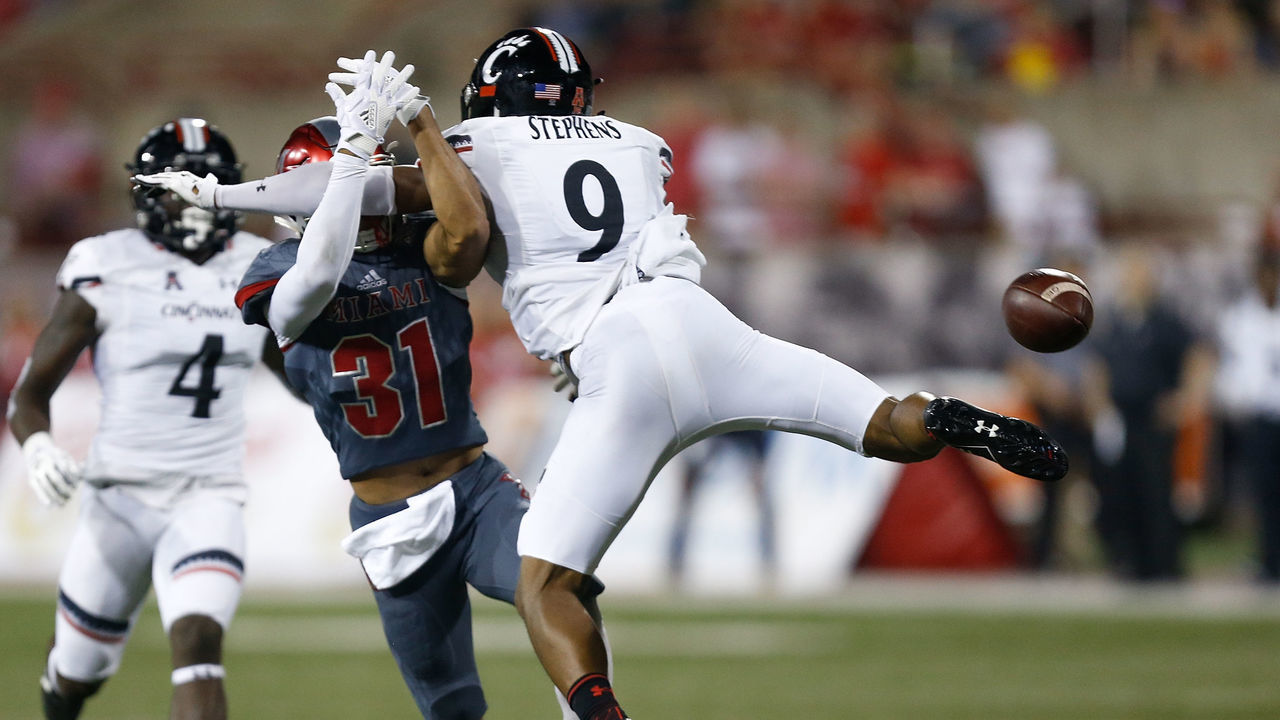 OXFORD, OH - SEPTEMBER 16: Linden Stephens #9 of the Cincinnati Bearcats blocks pass intended for Maurice Thomas #31 of the Miami Ohio Redhawks at Yager Stadium on September 16, 2017 in Oxford, Ohio.