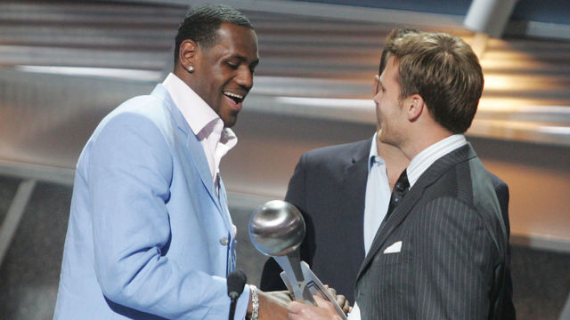 HOLLYWOOD - JULY 14: Winner for Best Breakthrough athlete, basketball player LeBron James is greeted on stage by quarterback Tom Brady at the 12th Annual ESPY Awards held at the Kodak Theatre on July 14, 2004 in Hollywood, California. This year's ESPY's will air Sunday, July 16th on ESPN beginning 9 PM EST/6 PM EST.