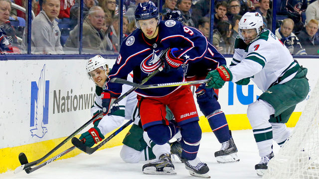 COLUMBUS, OH - JANUARY 30: Artemi Panarin #9 of the Columbus Blue Jackets and Matt Cullen #7 of the Minnesota Wild battle for control of the puck during the game on January 30, 2018 at Nationwide Arena in Columbus, Ohio. Minnesota defeated Columbus 3-2 in a shootout.