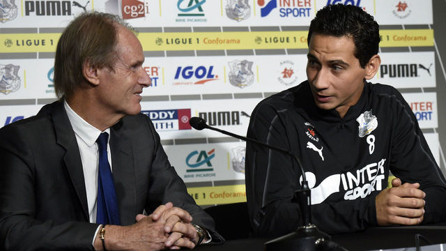 Amiens new player, Brazilian player Paulo Henrique Ganso (R) gives a press conference with Amiens' football club president Bernard Joannin (L) on September 7, 2018 in Amiens, during his offical presentation. - Ganso joined the Ligue 1 side on a one-year loan agreement that includes an option to buy.