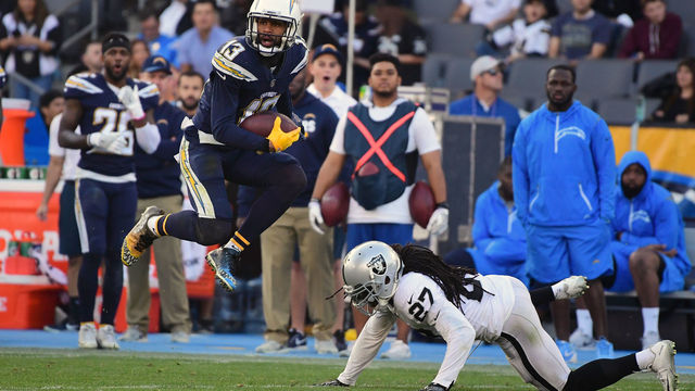 CARSON, CA - DECEMBER 31: Keenan Allen #13 of the Los Angeles Chargers makes a reception against Reggie Nelson #27 of the Oakland Raiders during the second quarter of the game at StubHub Center on December 31, 2017 in Carson, California.