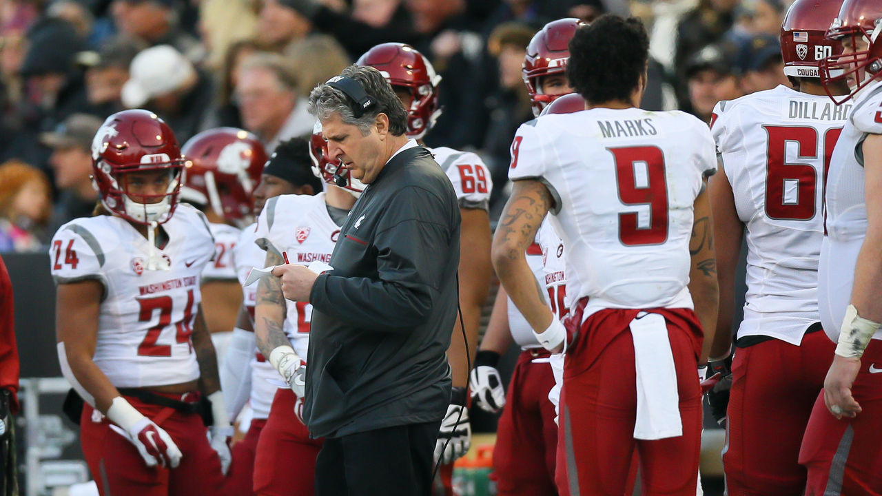 BOULDER, CO - NOVEMBER 19: Head Coach Mike Leach of the Washington State Cougars looks over plays on the sideline during the third quarter against the Colorado Buffaloes at Folsom Field on November 19, 2016 in Boulder, Colorado. Colorado defeated Washington State 38-24.