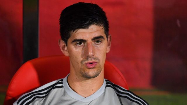 GIRONA, SPAIN - AUGUST 26: Thibaut Courtois of Real Madrid CF looks on from the bench prior to the La Liga match between Girona FC and Real Madrid CF at Montilivi Stadium on August 26, 2018 in Girona, Spain.