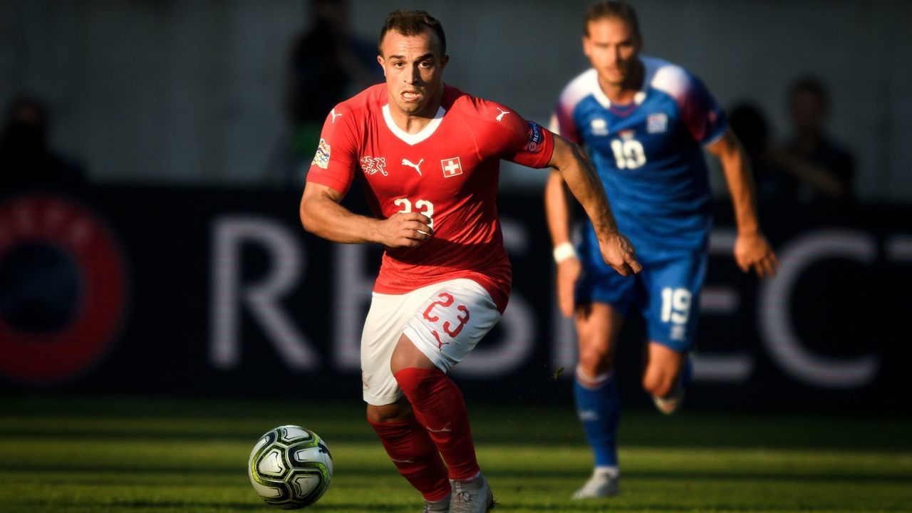 Switzerland's forward Xherdan Shaqiri (L) controls the ball during the UEFA Nations League football match between Switzerland and Iceland at the Kybunpark stadium in St Gallen on September 8, 2018.