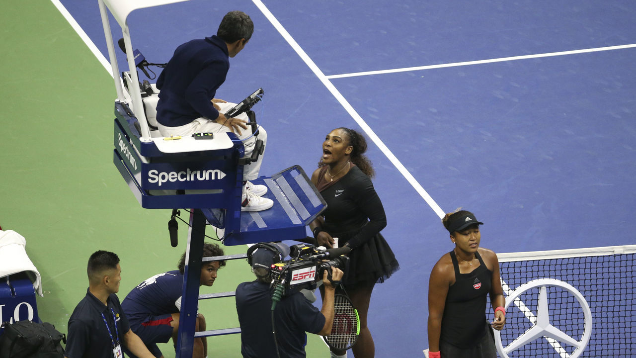 NEW YORK, NY - SEPTEMBER 8: Finalist Serena Williams of USA has a final word with umpire Carlos Ramos of Portugal while winner Naomi Osaka of Japan looks on following the women's final on day 13 of the 2018 US Open at Arthur Ashe Stadium of USTA Billie Jean King National Tennis Center on September 8, 2018 in Flushing Meadows, Queens, New York City.