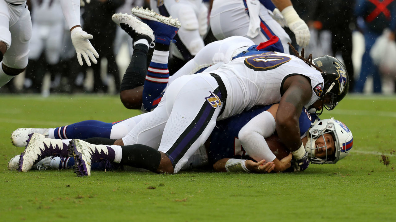 BALTIMORE, MD - SEPTEMBER 9: Nathan Peterman #2 of the Buffalo Bills is tackled by Za'Darius Smith #90 of the Baltimore Ravens in the first quarter at M&T Bank Stadium on September 9, 2018 in Baltimore, Maryland.