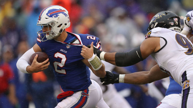 BALTIMORE, MD - SEPTEMBER 9: Quarterback Nathan Peterman #2 of the Buffalo Bills breaks a tackle by Za'Darius Smith #90 of the Baltimore Ravens in the first quarter at M&T Bank Stadium on September 9, 2018 in Baltimore, Maryland.