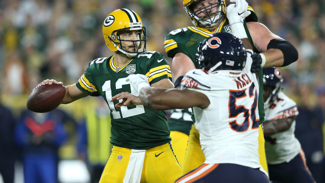 GREEN BAY, WI - SEPTEMBER 09: Aaron Rodgers #12 of the Green Bay Packers throws during the first quarter of a game against the Chicago Bears at Lambeau Field on September 9, 2018 in Green Bay, Wisconsin.