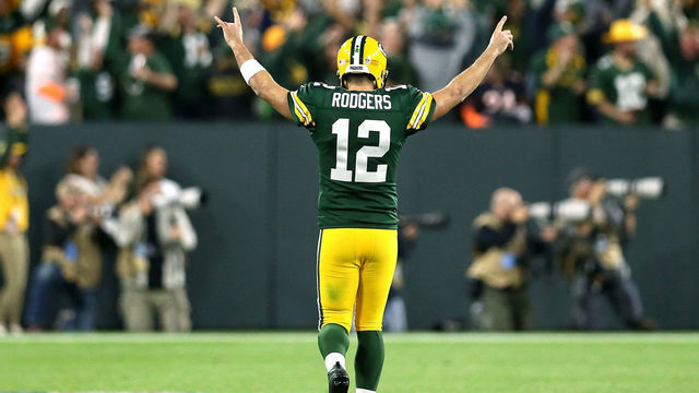 GREEN BAY, WI - SEPTEMBER 09: Aaron Rodgers #12 of the Green Bay Packers reacts after throwing a touchdown pass to Randall Cobb #18 during the fourth quarter of a game against the Chicago Bears at Lambeau Field on September 9, 2018 in Green Bay, Wisconsin.