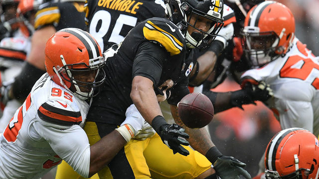 CLEVELAND, OH - SEPTEMBER 09: Myles Garrett #95 of the Cleveland Browns forces a fumble by James Conner #30 of the Pittsburgh Steelers during the fourth quarter at FirstEnergy Stadium on September 9, 2018 in Cleveland, Ohio.