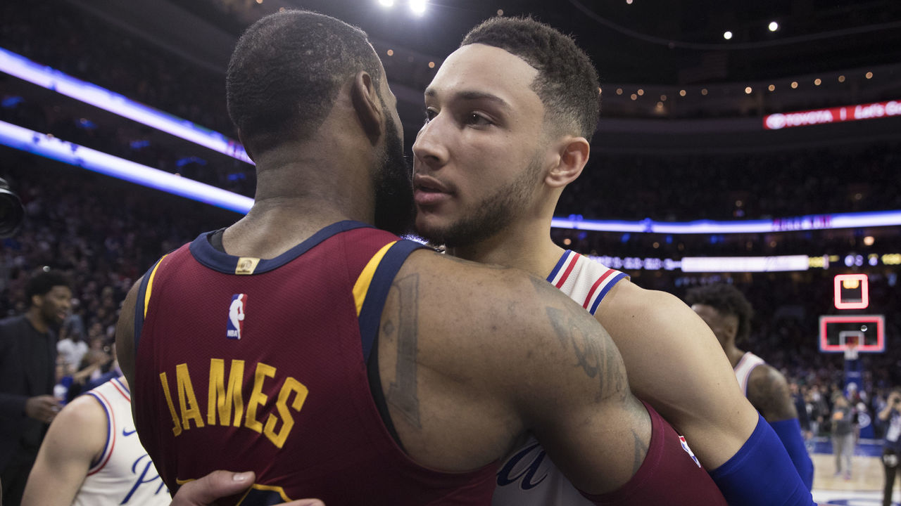 PHILADELPHIA, PA - APRIL 6: LeBron James #23 of the Cleveland Cavaliers hugs Ben Simmons #25 of the Philadelphia 76ers after the game at the Wells Fargo Center on April 6, 2018 in Philadelphia, Pennsylvania. The 76ers defeated the Cavaliers 132-130.