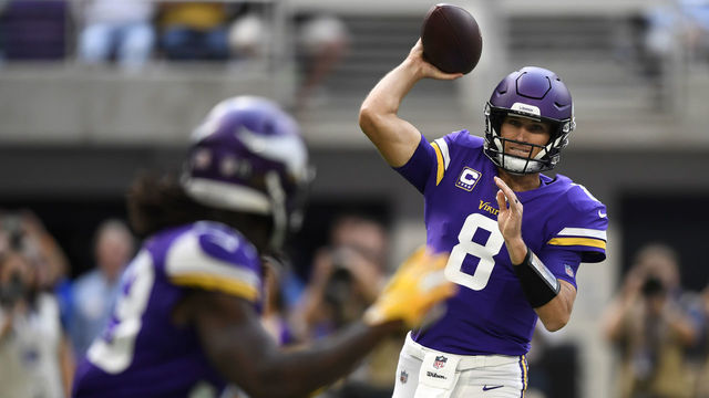 MINNEAPOLIS, MN - SEPTEMBER 09: Kirk Cousins #8 of the Minnesota Vikings passes the ball to Dalvin Cook #33 in the first quarter of the game against the San Francisco 49ers at U.S. Bank Stadium on September 9, 2018 in Minneapolis, Minnesota.