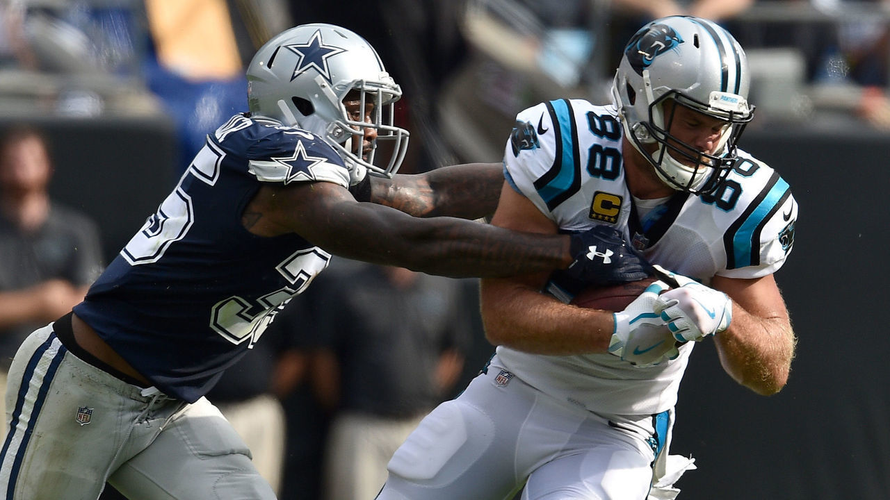 CHARLOTTE, NC - SEPTEMBER 09: Greg Olsen #88 of the Carolina Panthers runs the ball against Kavon Frazier #35 of the Dallas Cowboys in the second quarter during their game at Bank of America Stadium on September 9, 2018 in Charlotte, North Carolina.