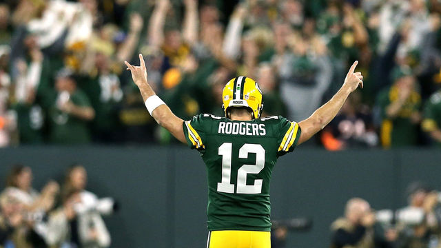 GREEN BAY, WI - SEPTEMBER 09: Aaron Rodgers #12 of the Green Bay Packers reacts after throwing a touchdown pass to Randall Cobb #18 during the fourth quarter of a game against the Chicago Bears at Lambeau Field on September 9, 2018 in Green Bay, Wisconsin.