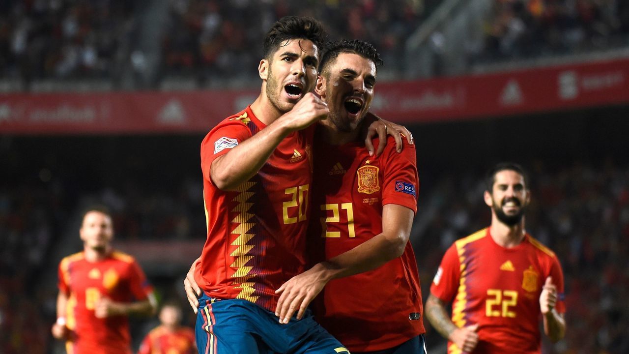 Spain's midfielder Marco Asensio (L) celebrates with Spain's midfielder Dani Ceballos after scoring a goal during the UEFA Nations League A group 4 football match between Spain and Croatia at the Manuel Martinez Valero stadium in Elche on September 11, 2018.