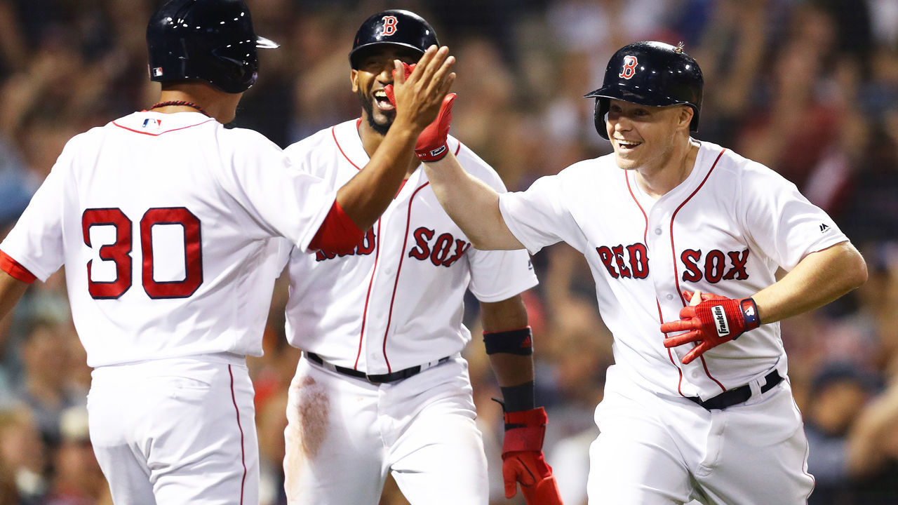 BOSTON, MA - SEPTEMBER 11: Brock Holt #12 of the Boston Red Sox celebrates with Tzu-Wei Lin #30 after hitting a three run home run against the Toronto Blue Jaysduring the seventh inning at Fenway Park on September 11, 2018 in Boston, Massachusetts.