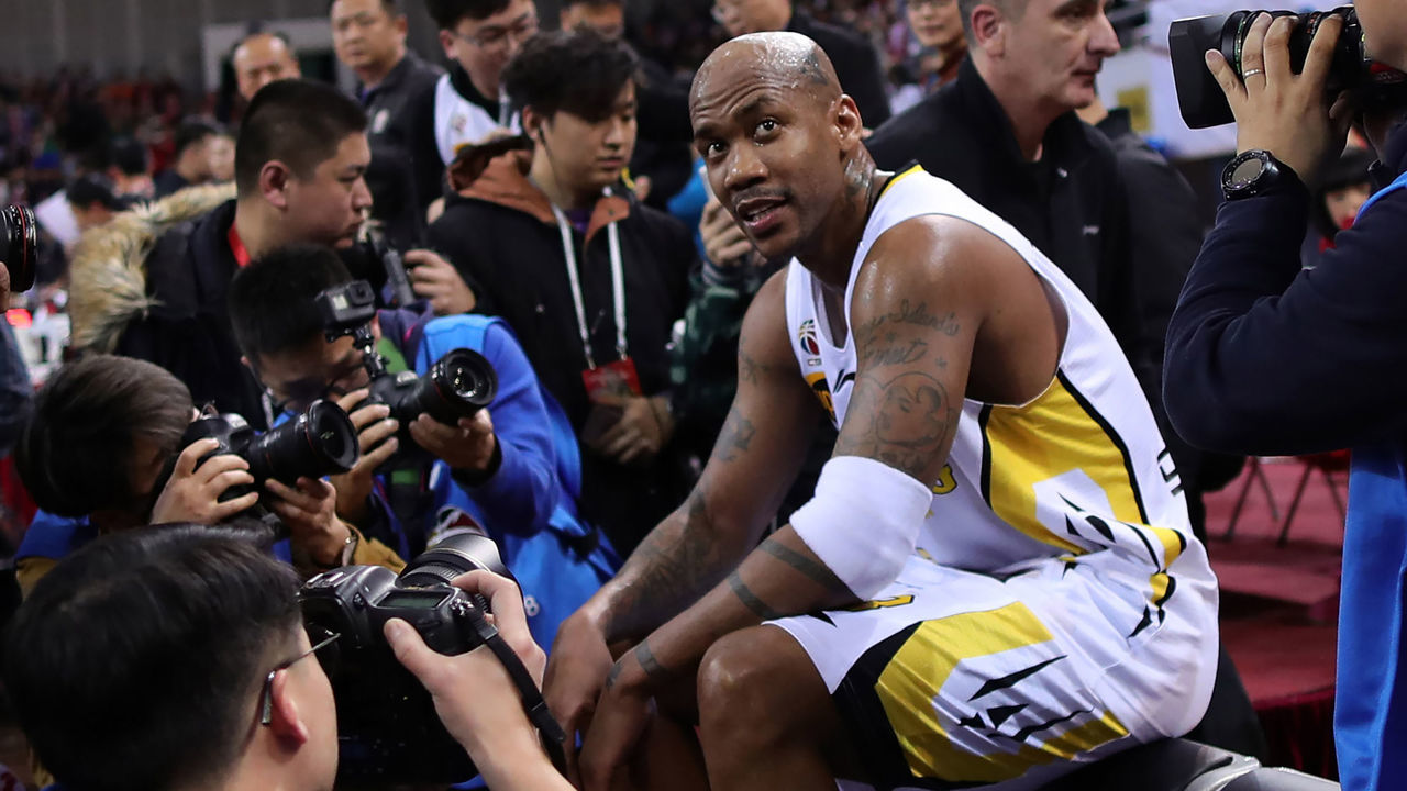 Former NBA player Stephon Marbury looks on after his final game for the Chinese Basketball Association's Beijing Fly Dragons in Beijing on February 11, 2018. Marbury retired from pro basketball on February 11, 2018 after a 22-year career. / AFP PHOTO / - / China OUT